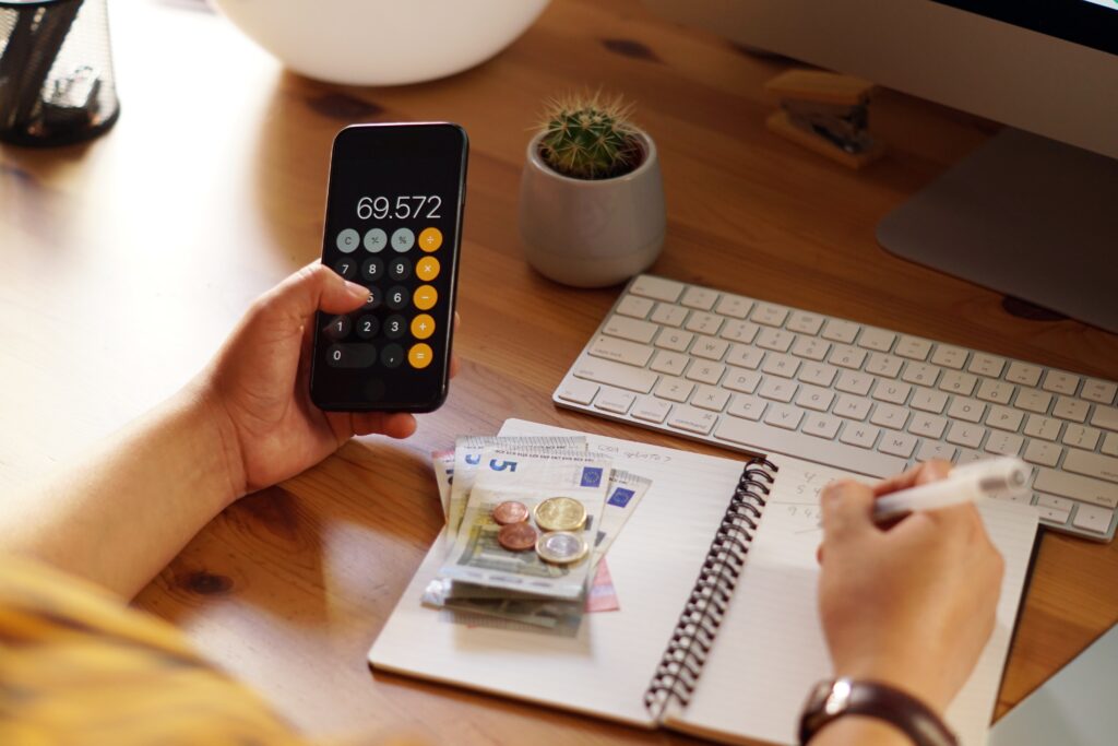 closeup shot of an entrepreneur working from home on his personal finances and savings